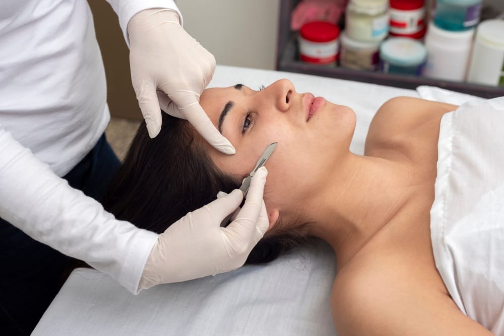 Young Female Receiving Dermaplaning Treatment in Houston, TX | Vida Aesthetics And Wellness