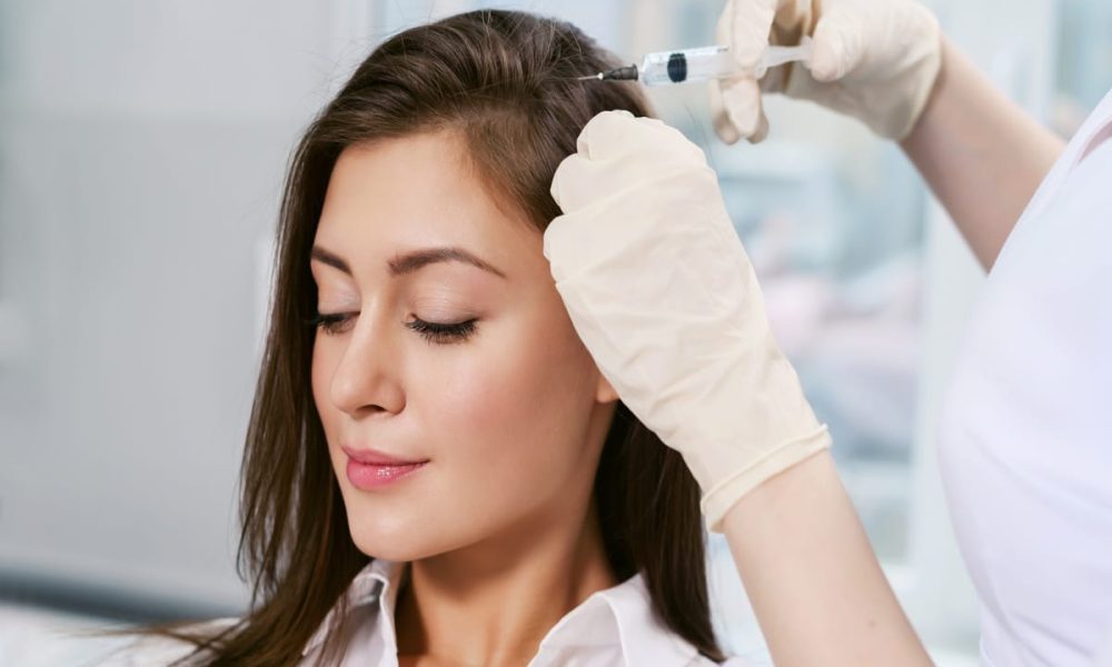 Woman getting hair restoration treatment in Houston, TX | Vida Aesthetics And Wellness