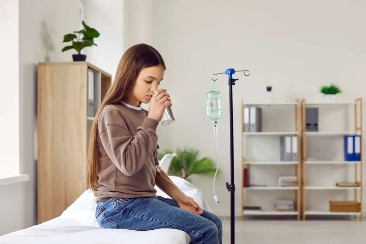 Young girl drinking water in Houston, TX | Vida Aesthetics And Wellness